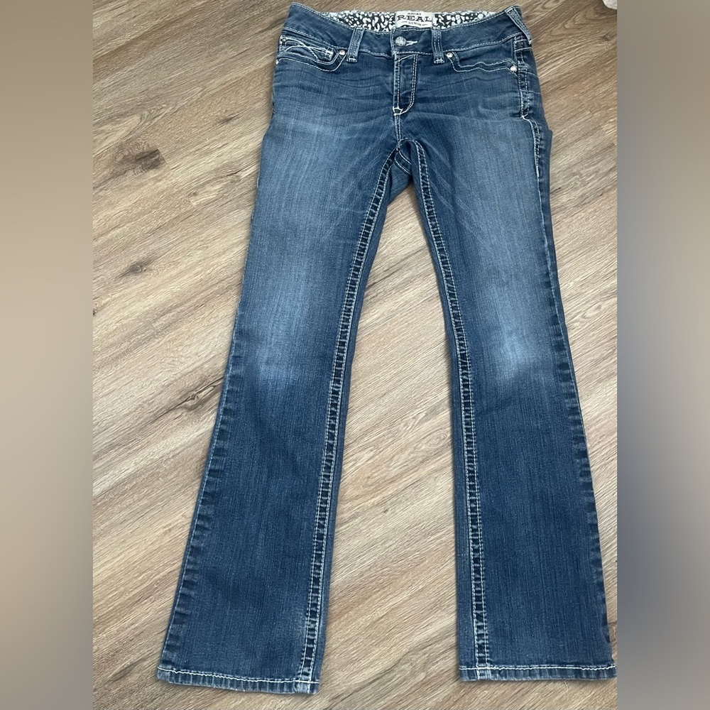 R.E.A.L. Mid Rise Stretch Whipstitch Boot Cut Jean